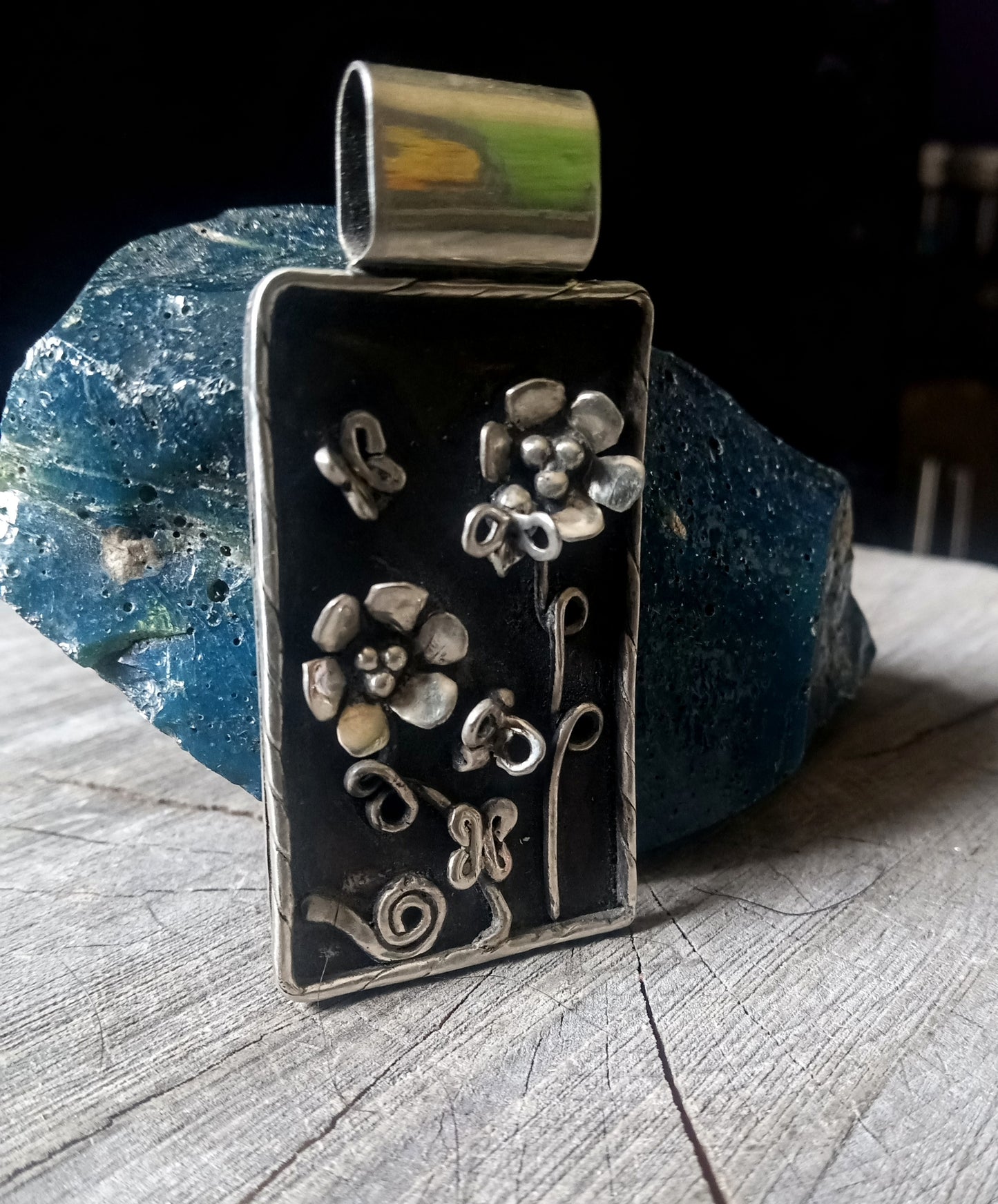 Nature scene pendant bees, butterflies, flowers and a snail.