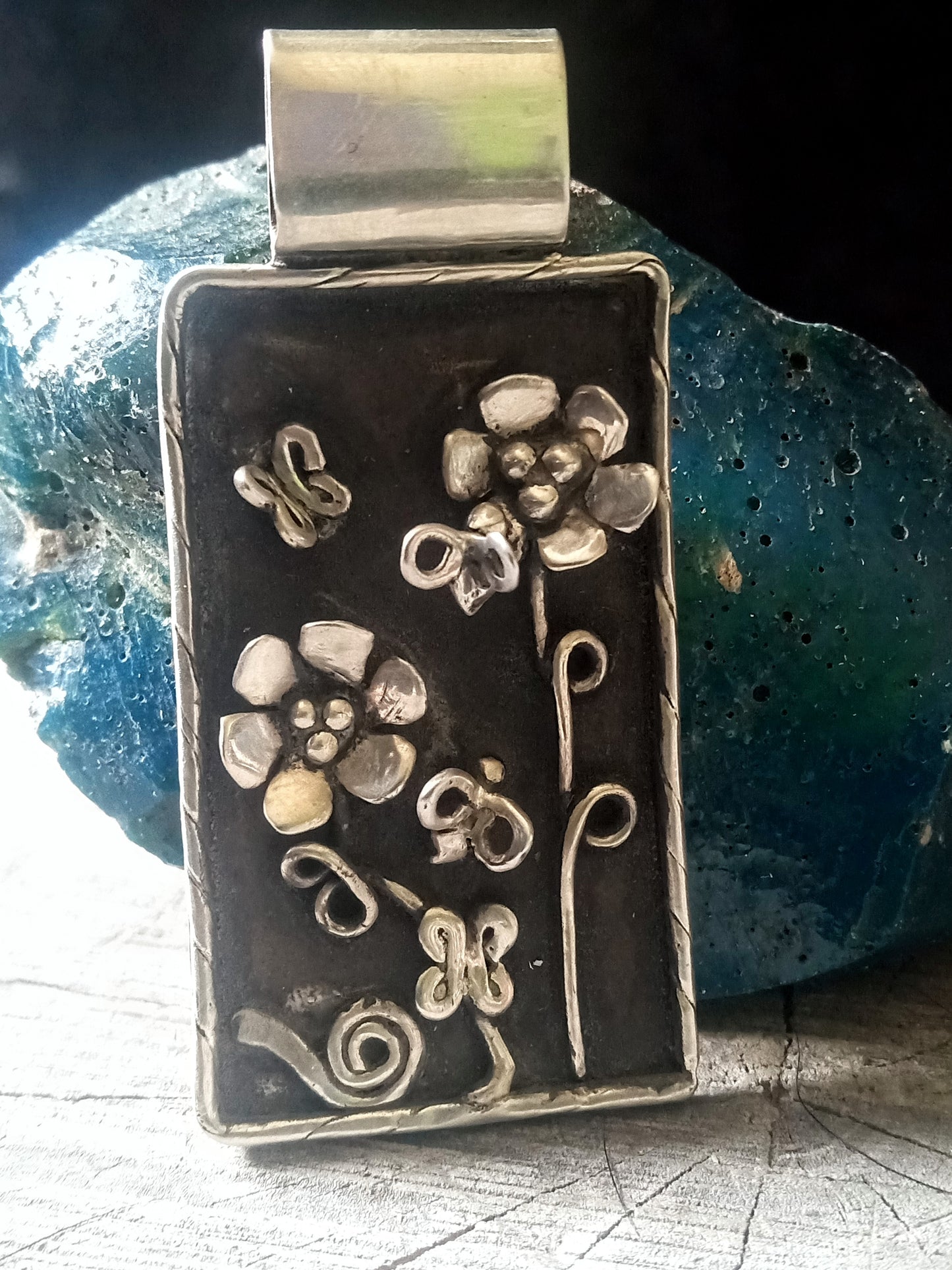 Nature scene pendant bees, butterflies, flowers and a snail.