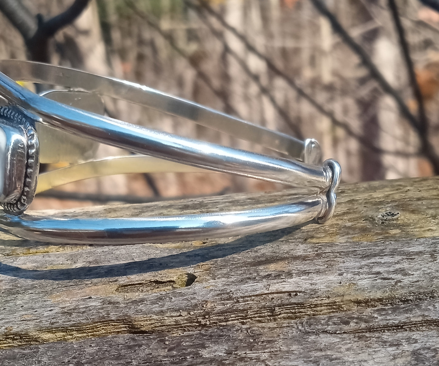 Exquisite handcrafted face cuff and fine silver .