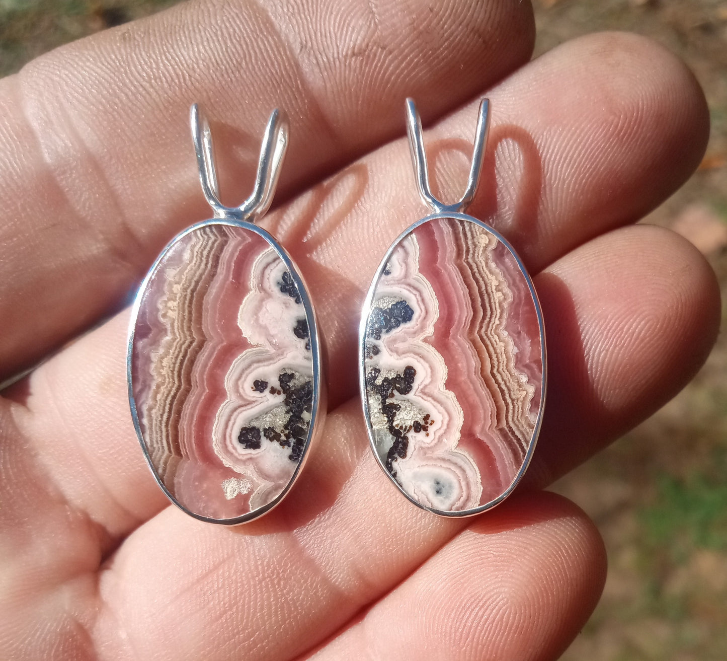 A perfect pair of Rhodochrosite pendants