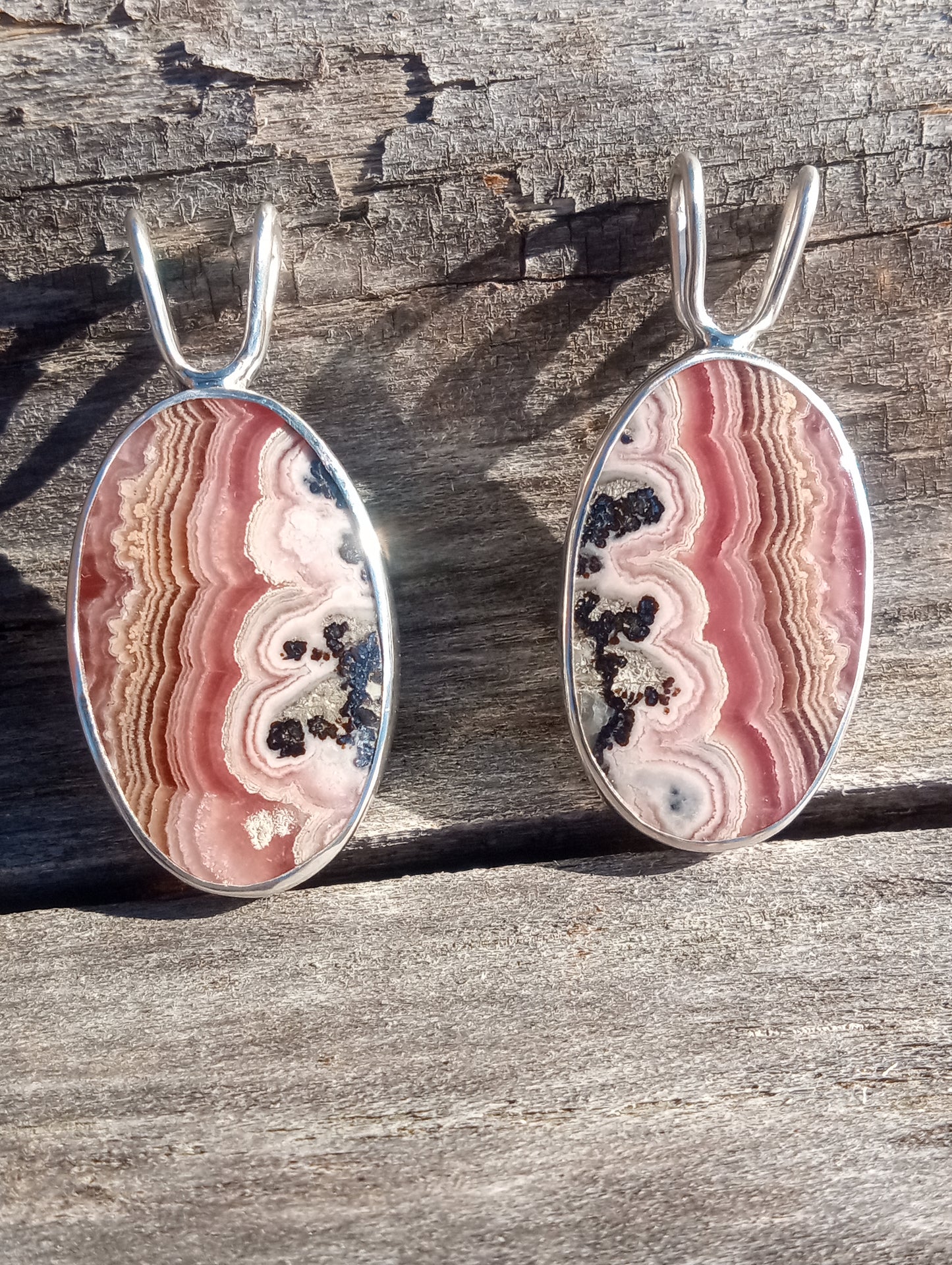 A perfect pair of Rhodochrosite pendants