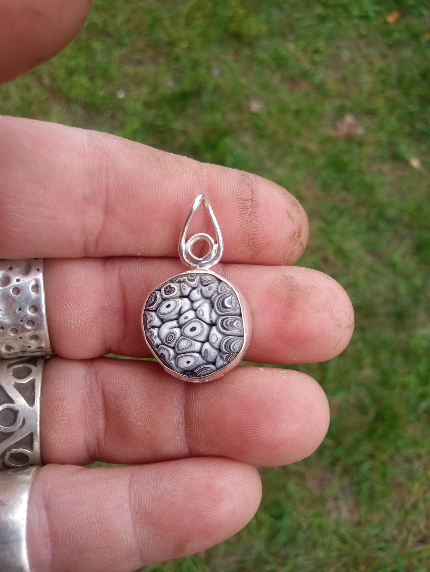 Handcrafted Fordite and fine silver pendant