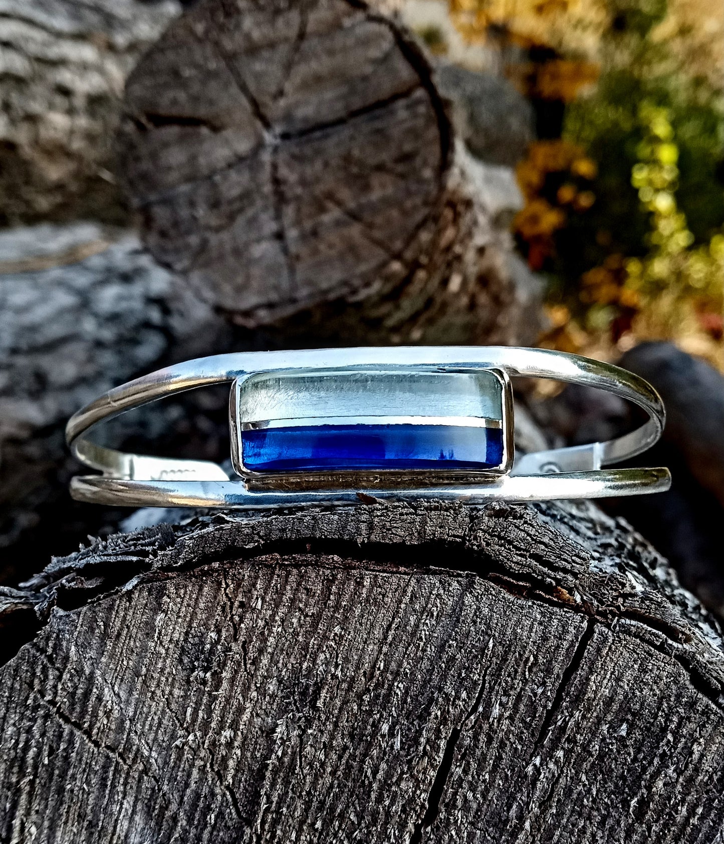 Blue and clear  fine silver center band beach glass cuff