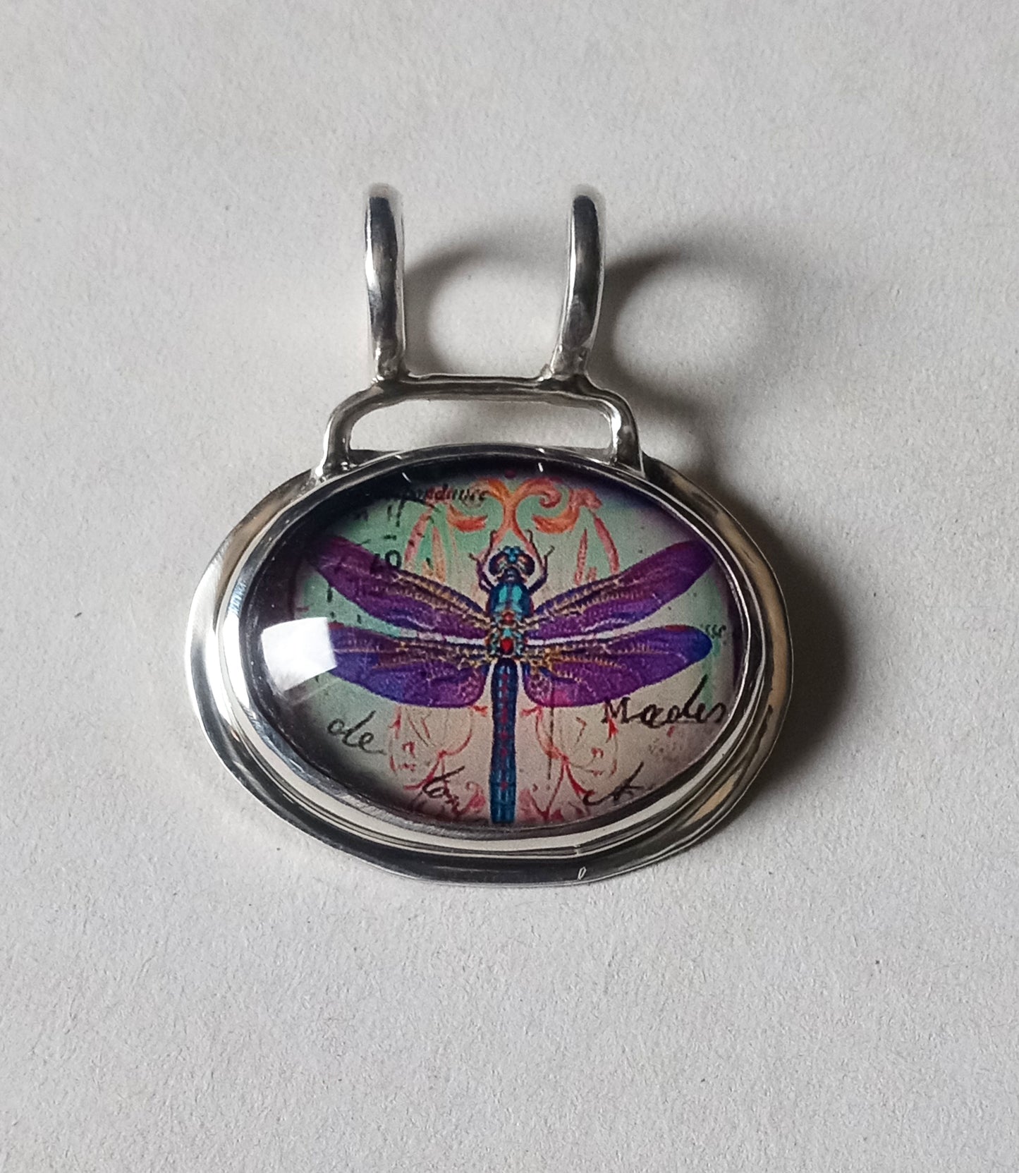 Beautiful dragon fly pendant set in fine silver