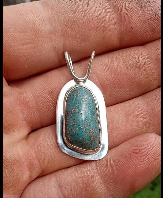 Leland blue with silver inlay set in fine silver pendant