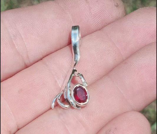 Handheld ruby pendant