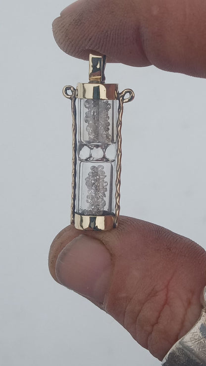 Solid 10k gold hourglass with 1.6 ctw full cut diamonds. Pendant.