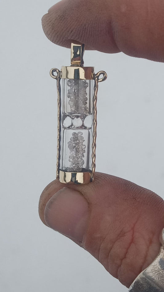 Solid 10k gold hourglass with 1.6 ctw full cut diamonds. Pendant.