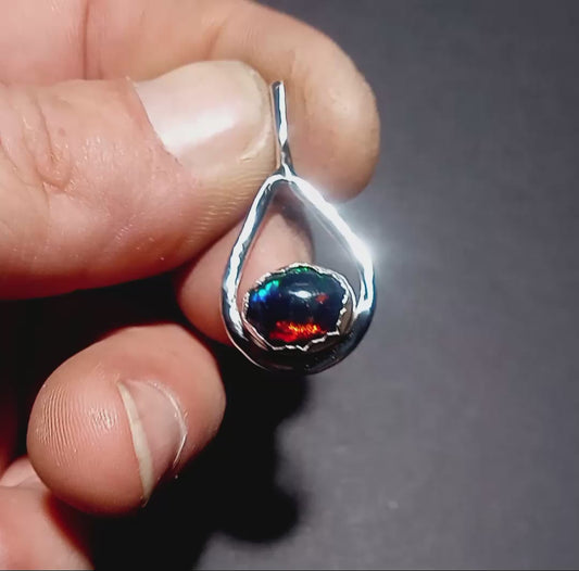 Black opal in fine silver pendant