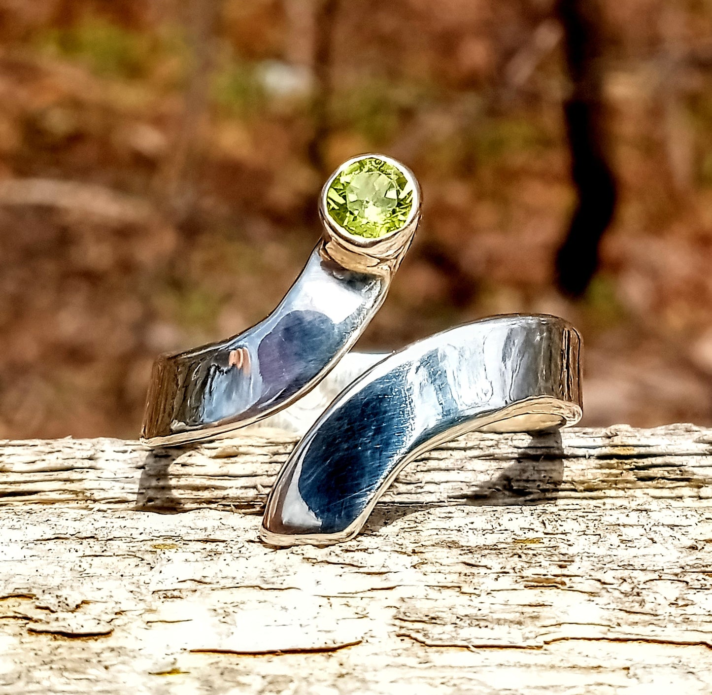 Brilliant cut peridot fine silver bypass ring