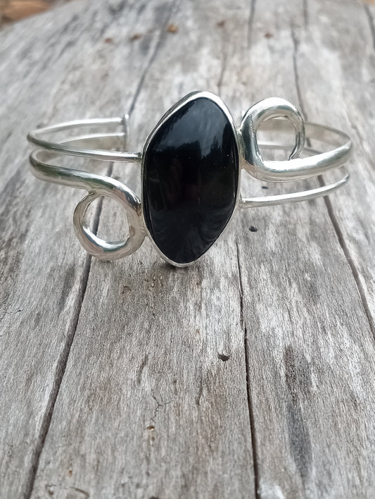 This beautiful cuff I just finished straight off the bench . The setting pure . 999 fine silver the stone obsidian. I hope you enjoy. Be a creator.