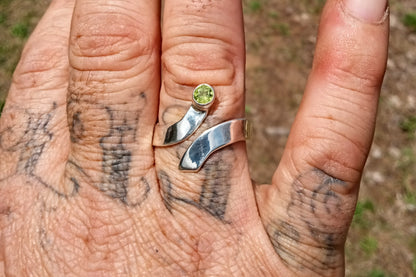 Brilliant cut peridot fine silver bypass ring