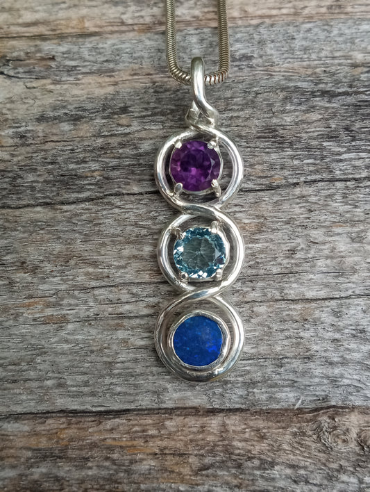 Top class fine silver pendant featuring lightning ridge black opal, aquamarine and amethyst.