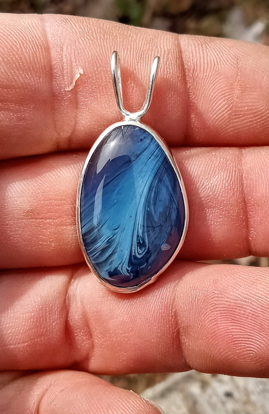 Reversible blue and Petoskey stone pendant