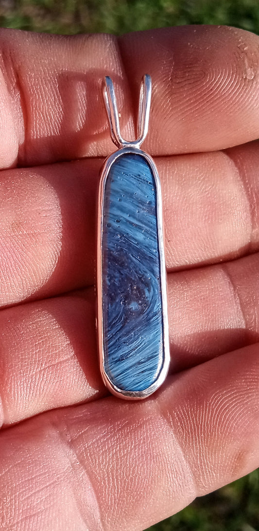 Reversible blue slag pioneer swirl glass and Petoskey stone fossil.