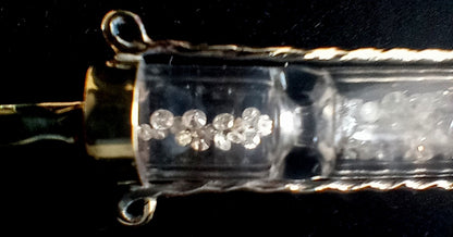Solid 10k gold hourglass with 1.6 ctw full cut diamonds. Pendant.