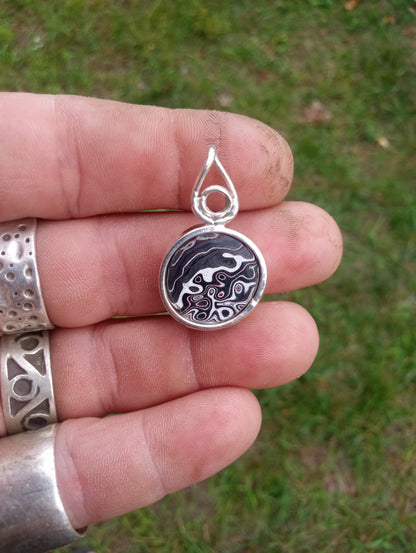 Handcrafted Fordite and fine silver pendant