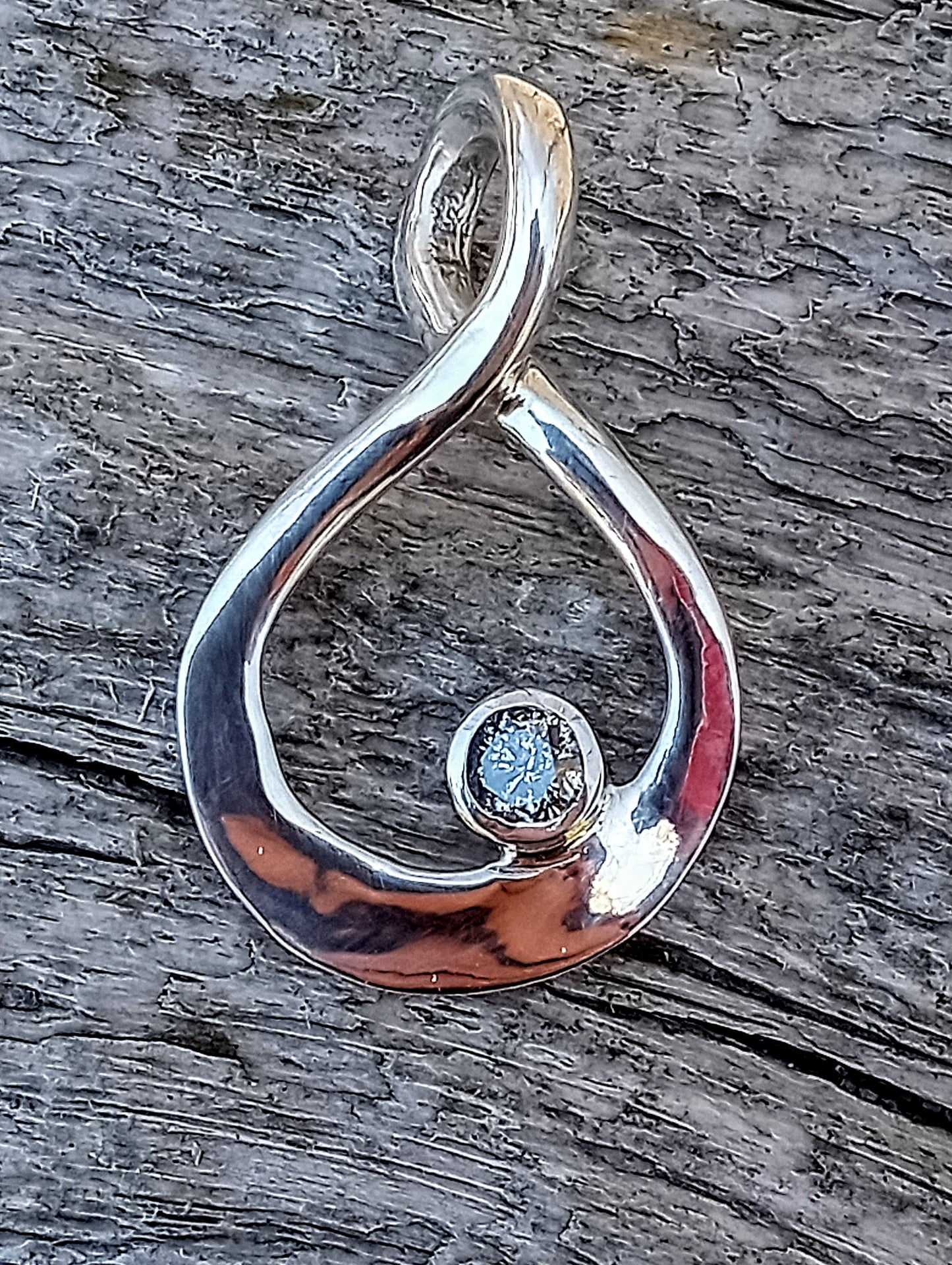 Quarter carat brilliant cut natural silver diamond pendant.