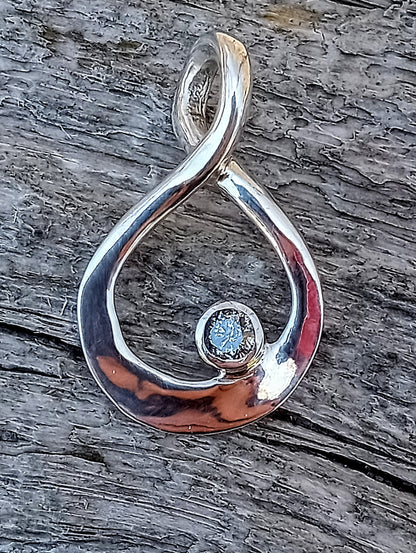 Quarter carat brilliant cut natural silver diamond pendant.