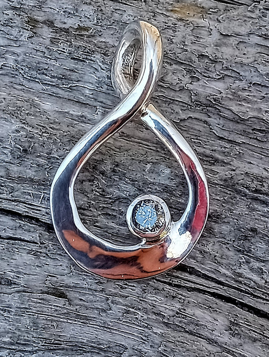 Quarter carat brilliant cut natural silver diamond pendant.
