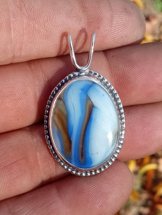 Marble slag glass pendant set in fine silver