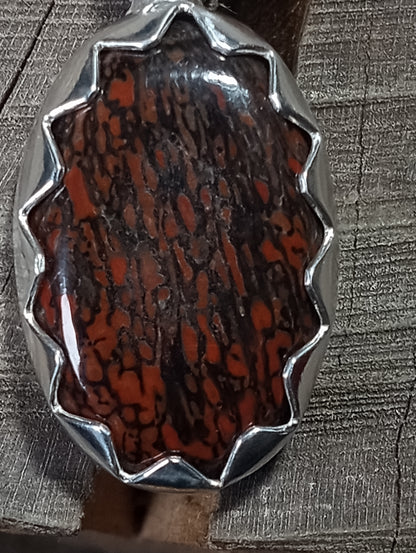 Dinosaur agatized/fossil bone pendant in fine silver