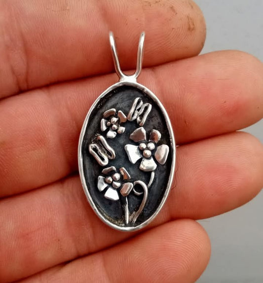 Beautiful butterflies and flowers handcrafted from fine silver